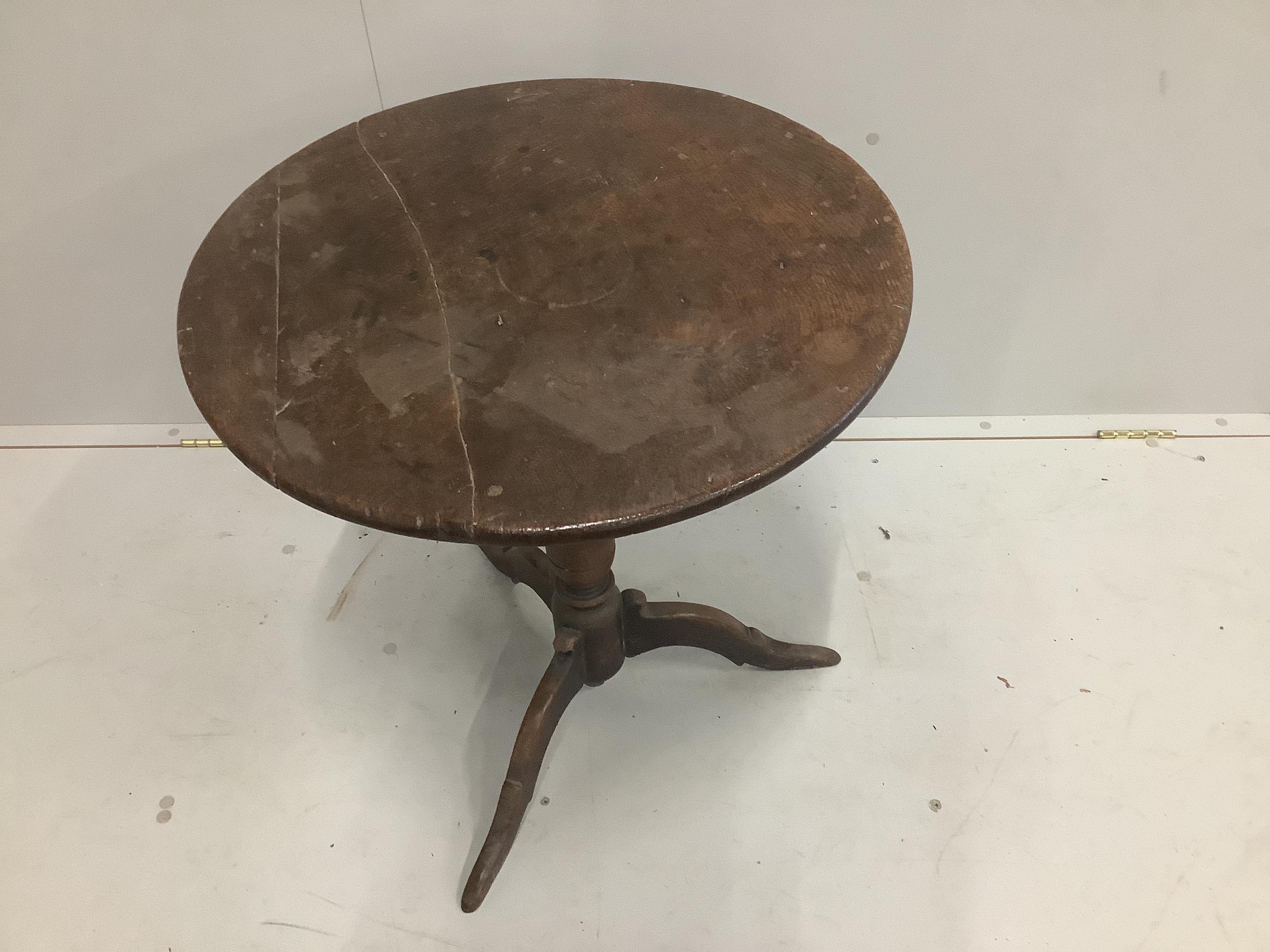 A mid 18th century oak tripod table with bird cage stem, width 60cm, height 63cm